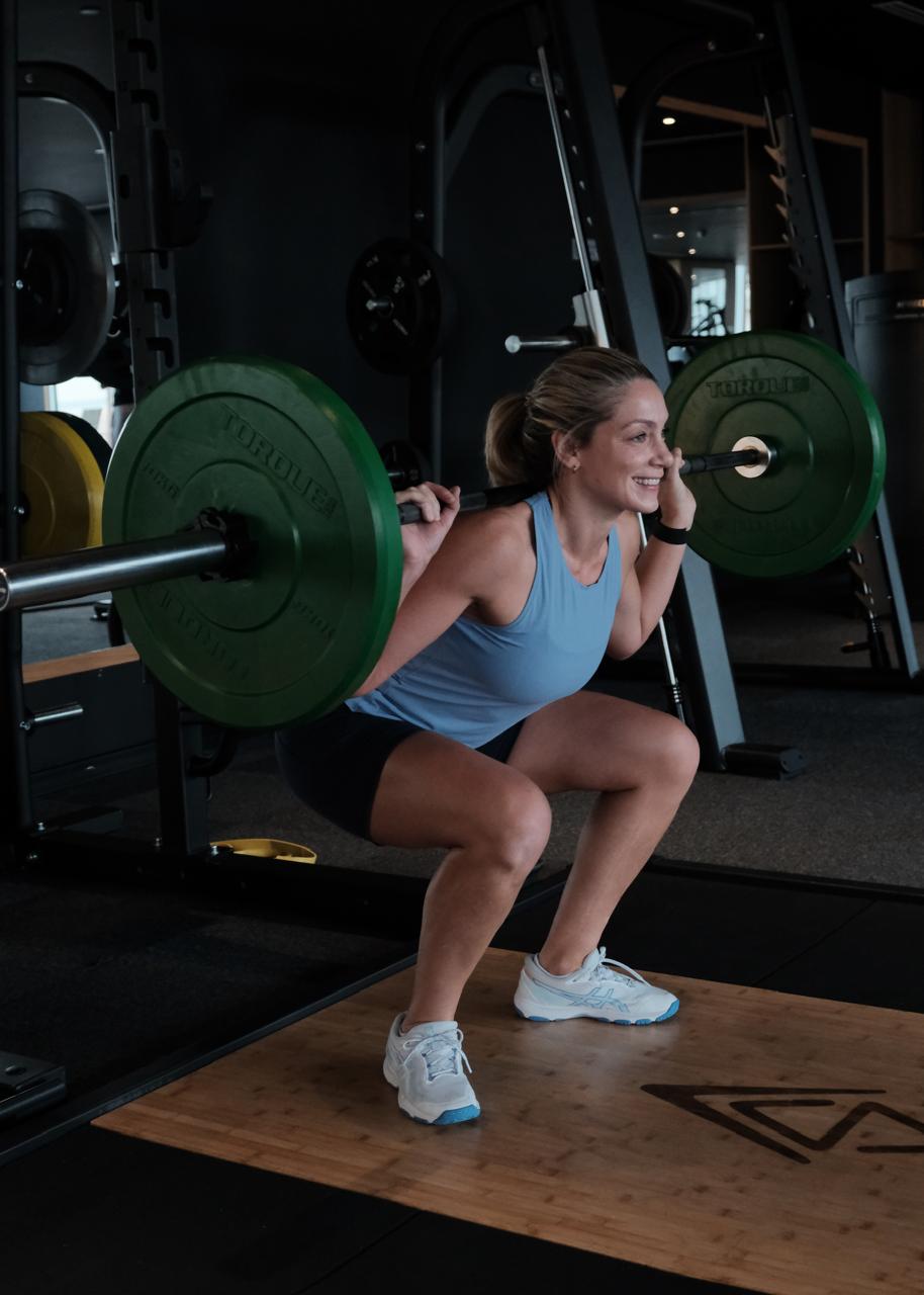 Gym training with a barbell squat